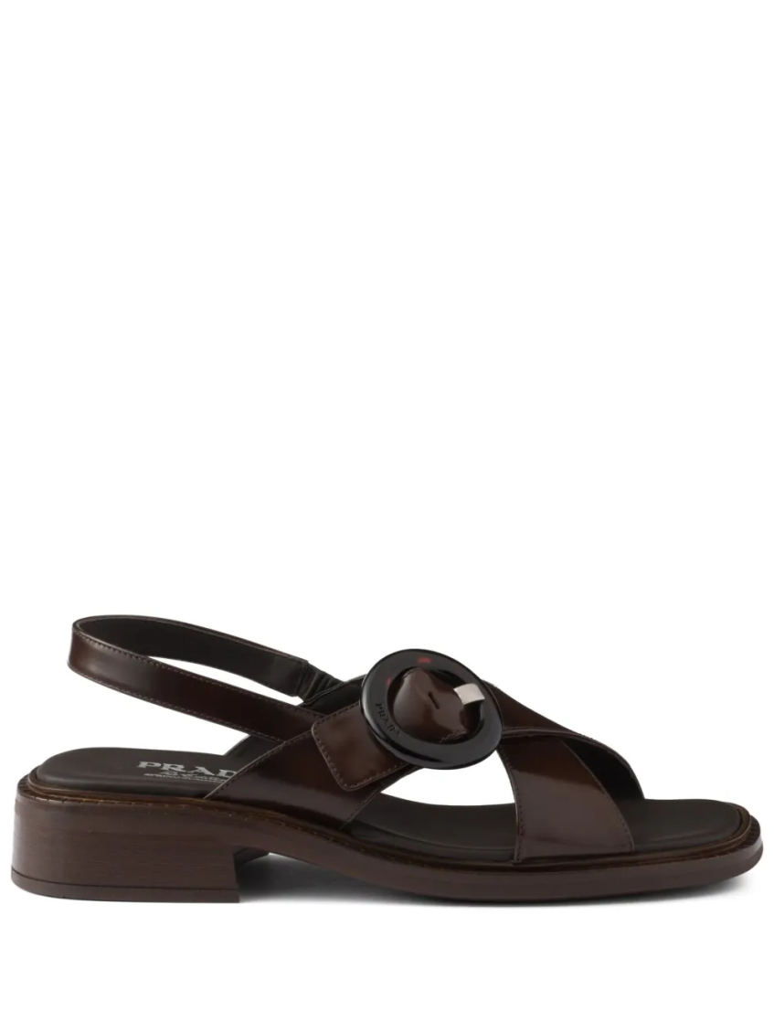 Prada Brushed Leather Crisscross Band Sandals With Plexiglas Buckle In Brown